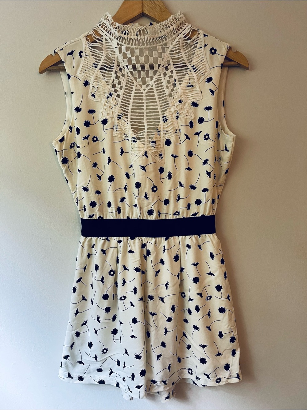 One Piece sleeveless Romper. White and floral jumpsuit.